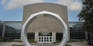 Statue of engineering ring in front of Engineering building at McMaster