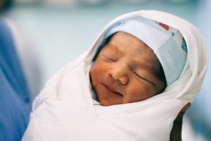A swaddled newborn