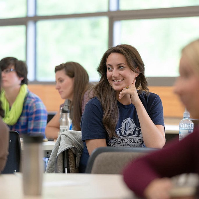 Female smiling at something out of frame