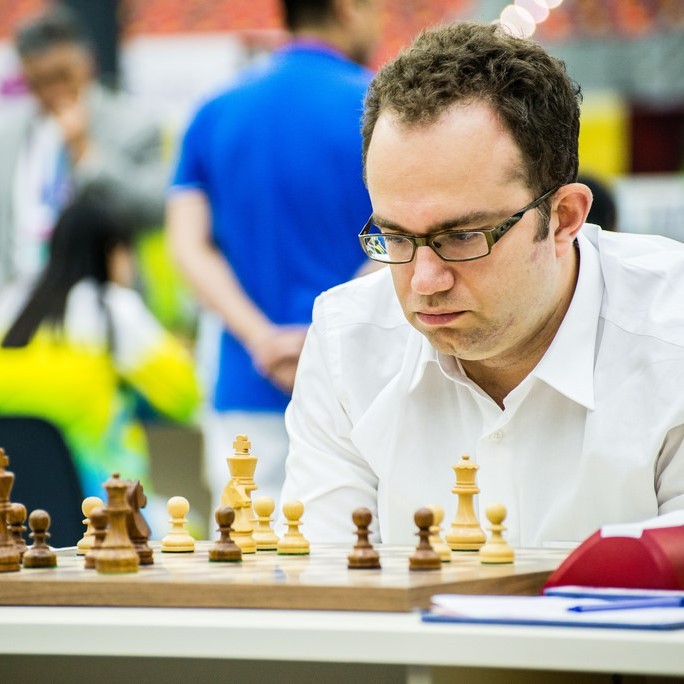 photo of man playing chess