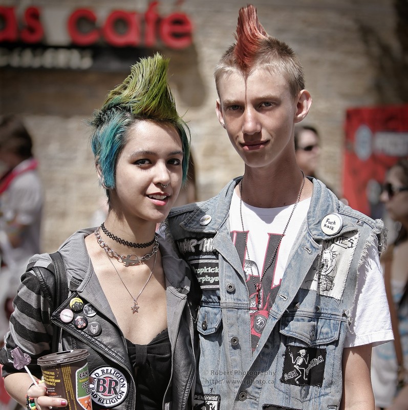 adolescent male and female wearing punk rock clothing