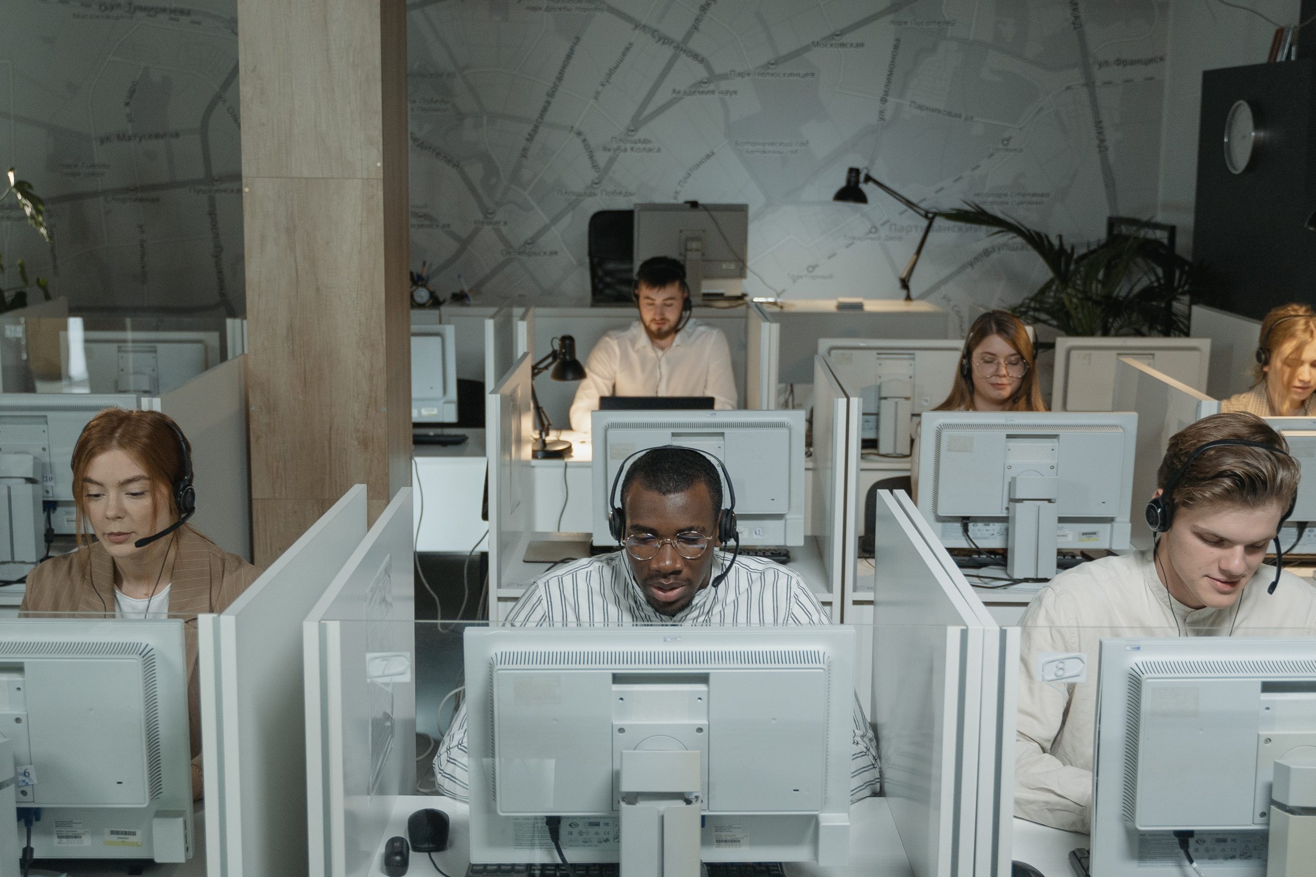 customer service representatives working in cubicles