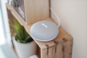 round grey speaker on shelf