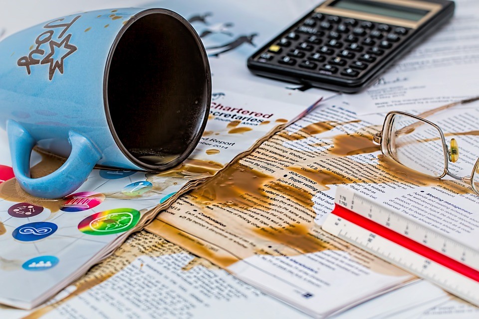 coffee spilled on papers