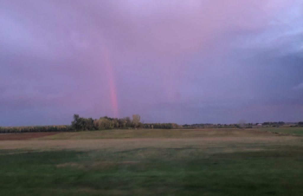 A photograph of a rainbow, untouched. It's very red.