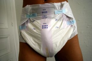 A man wearing a disposable brief with tabs.